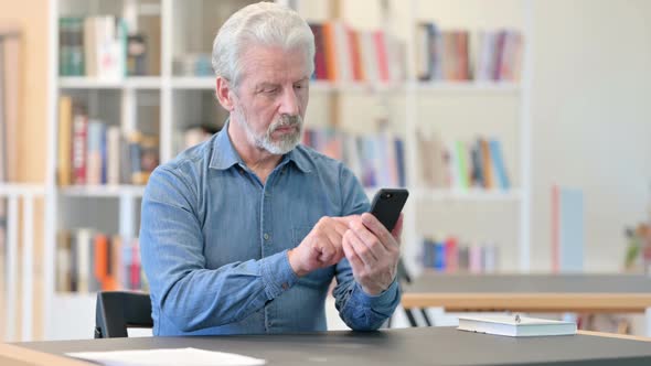 Old Man Using Smartphone