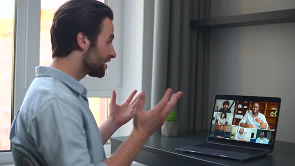 Caucasian Man Using Laptop for Video Connection with Friends