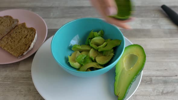 Time Lapse of Cooking Avocado Toast  Cut the Avocado and Take Out the Pulp Chop It and Put on Bread