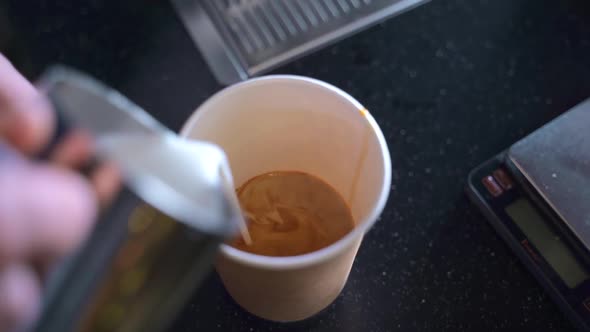 Male Worker Preparing Aromatic Coffee While Standing at Table in Cafe Kitchen Spbas