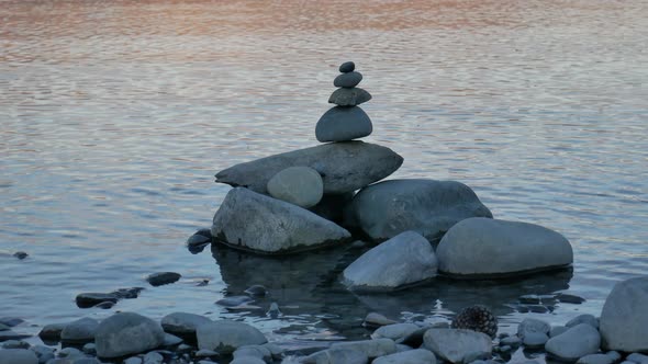 Balance stack zen stone near lake