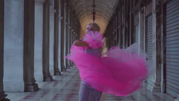 Happy Girl Smiles and Runs in Slow Motion in Pink Dress