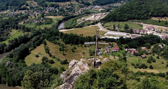 Cross Stands At The Peak Of Apuseni Mountains With A View Of The Village And Aries River