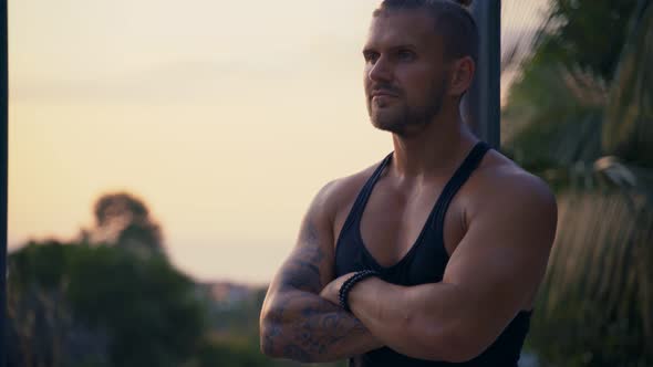 An Athletic Man Relaxing After a Productive Workout in the Outdoor Gym.