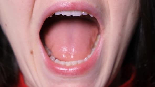 A Patient with Temporomandibular Joint Dysfunction Opens His Mouth Widely