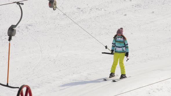 Amateur Skier Girl on a Lift