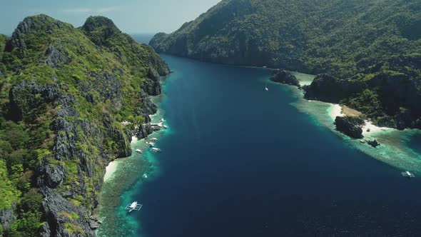 Rise Up Aerial Shot of Mountains Islands with Boats Yachts at Ocean Bay Coast