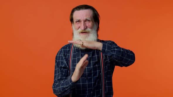 Tired Serious Upset Mature Old Bearded Grandfather Showing Time Out Gesture Limit or Stop Sign