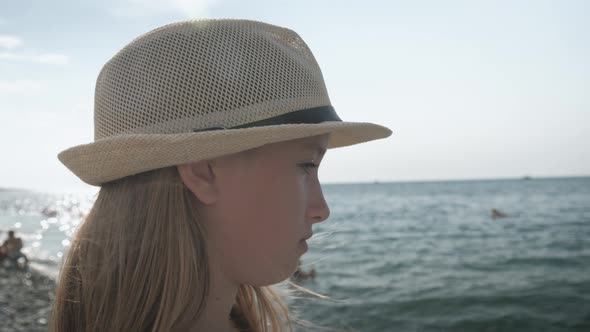 Teen Girl Running on the Beach at the Daytime. Young Girl Walking on the Sea.