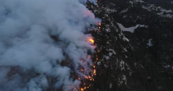 Aerial Panoramic View of a Forest Fire at Night Heavy Smoke Causes Air Pollution and Fire in Full