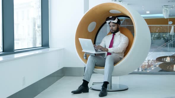 Smiling Businessman with Laptop and Vr Headset