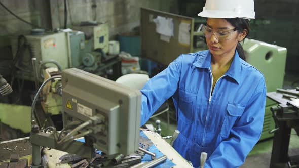 candid asian female Professional engineering wearing uniform and safety goggles