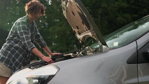 Breakdown Of The Car Girl Opened The Hood Of The Car Car Repair Outdoors Street Girl Checks The Oil