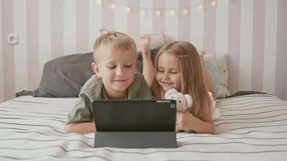 Kids playing with laptop