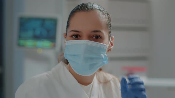 Portrait of Biologist Removing Face Mask Before Working in Laboratory