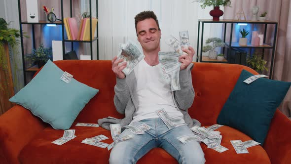 Successful Happy Rich Business Man Counting Money Cheering Up with High Profits Lottery Game Win