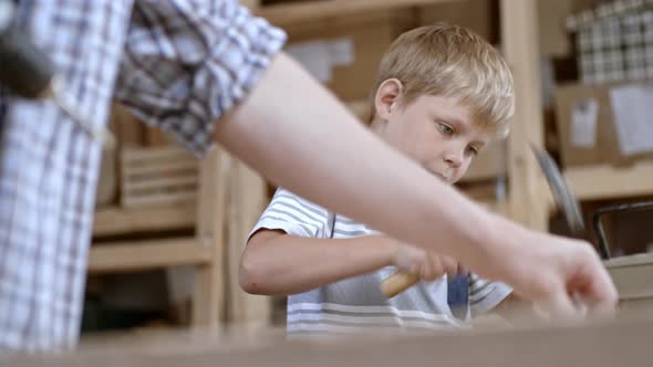 Boy Using Hammer