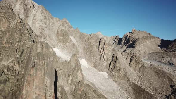 Rocky and steep mountains in the swiss alps. aerial drone view