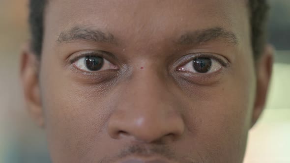 Close Up of Blinking Eyes of African Man 