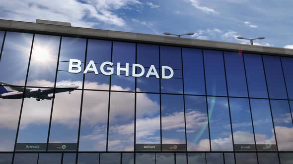 Airplane landing at Baghdad Iraq airport mirrored in terminal alt