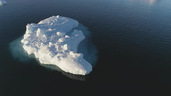 Iceberg Float in Clear Water Ocean Drone Above View