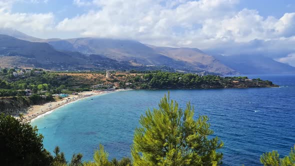 Panning of Guidaloca beach popular Italian tourist destination in Sicily near Scopello. Italy