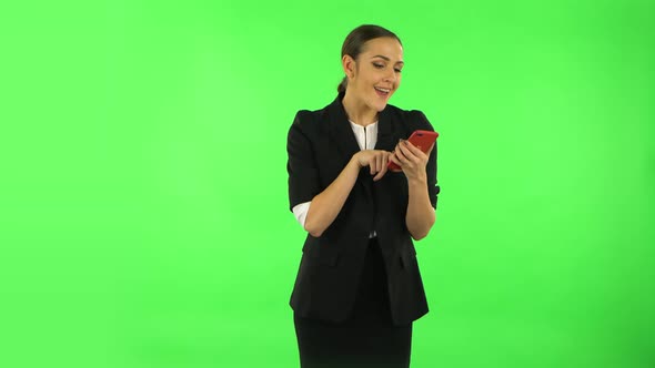 Girl Asks for Information on the Network Via Phone. Green Screen