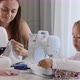 A Girl is Sewing on a Machine - VideoHive Item for Sale