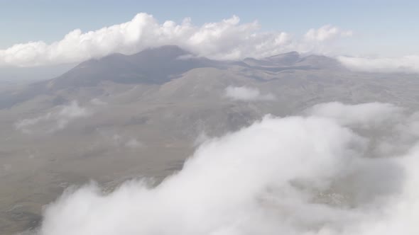 Scenic aerial view of moving white clouds at Abuli Mountain. Georgia