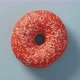 Orange Glazed Donut Rotating on Blue Top View - VideoHive Item for Sale