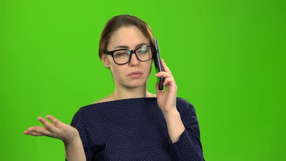 Businesswoman Speaks on the Phone and Is Angry with the Interlocutor. Green Screen