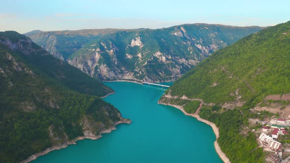 Aerial v Iew on Piva Lake with Turquoise Water and Beauty Green Mountains Near Puzine City in