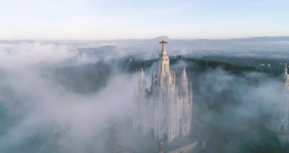 The Topview of the Big Statue of the Sacred Heart in the Temple of Tibidabo