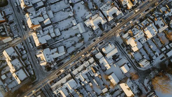 Snowy Streets and Houses in the Early Morning Bird's Eye View