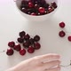 Lady hands take red cherry from white bowl young woman eats - VideoHive Item for Sale