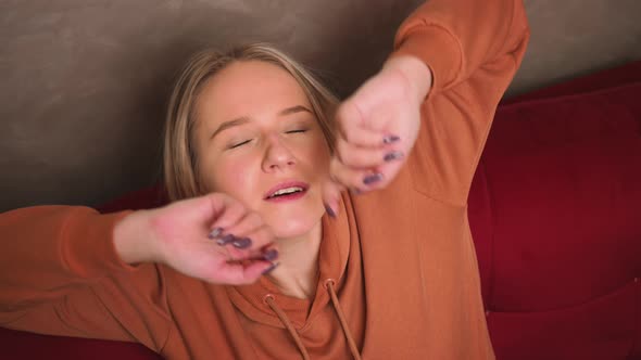 Happy Attractive Young Woman Resting on Couch Taking a Deep Breath of Fresh Air Woman Relaxing