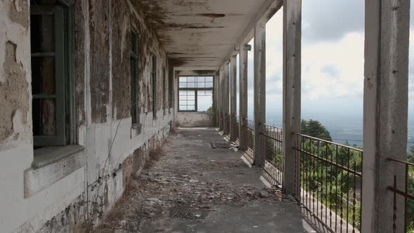 Lowering down in a hallway of the abandoned Caramulo Sanatorium.