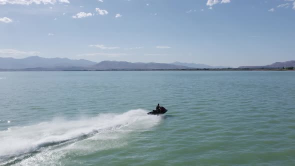 Adrenaline Thrill-Seeker Speeding on Jet Ski Sea Doo on Utah Lake - Aerial