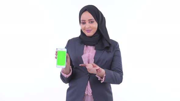 Happy Young African Muslim Businesswoman Showing Phone and Giving Thumbs Up