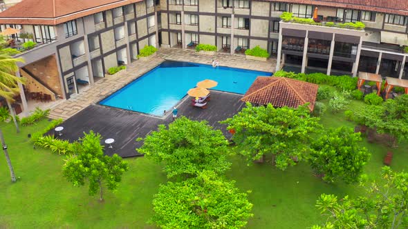 Swimming Pool Surrounded By Lush Tropical Plants