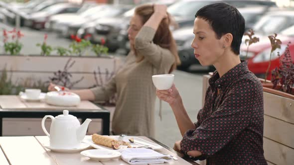 Women Eating in Summer Street Cafe