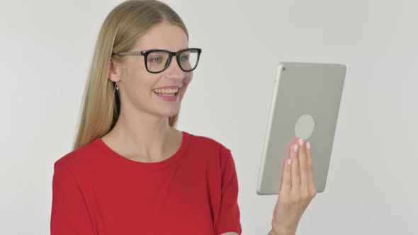 Video Call on Tablet by Young Woman on White Background