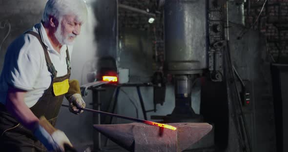 Blacksmith Creating Metalwork in Mastershop