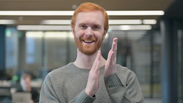 Portrait Shot of Happy Young Man Clapping Applauding