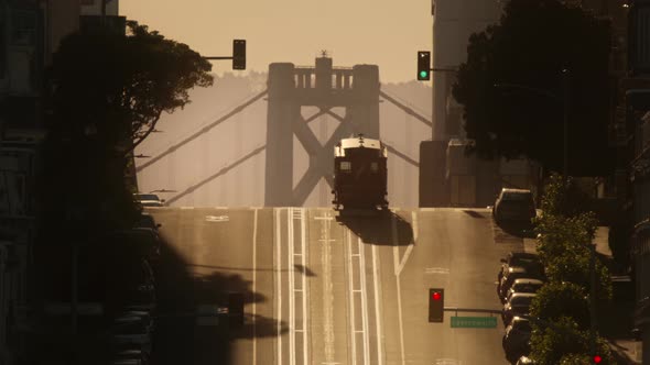 California Street in San Francisco Historic Tram Riding Up Hill with Bay Bridge