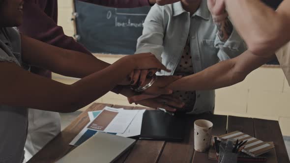 Putting Hands Together as Team in Office