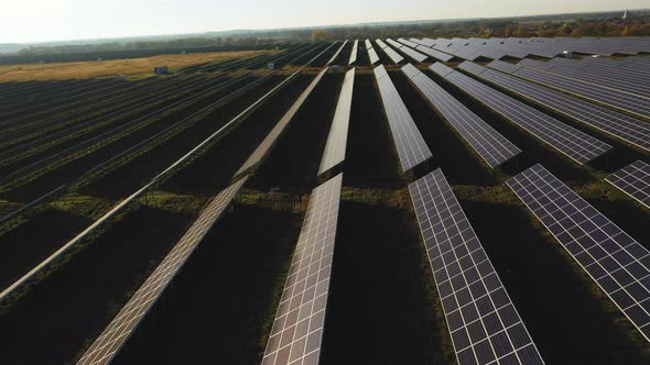 Drone Flight Over Rows of Solar Panels