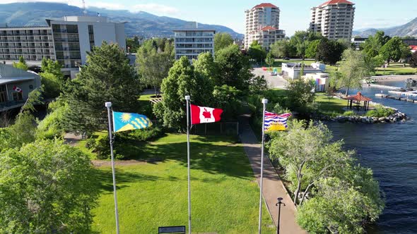 Flags of Penticton, British Columbia and Canada flying on Okanagan Beach, Penticton, BC