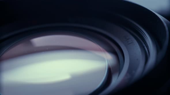 the lens of a movie camera or photo camera is shot in close-up