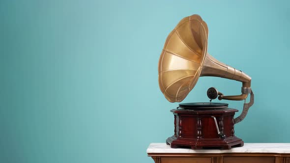 4K Video. Old vintage gramophone playing a vinyl on an isolated background. Music concept.